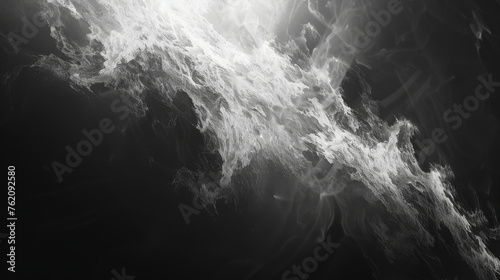 Abstract smoke billows and swirls against a black background, forming an intriguing and dynamic visual composition.