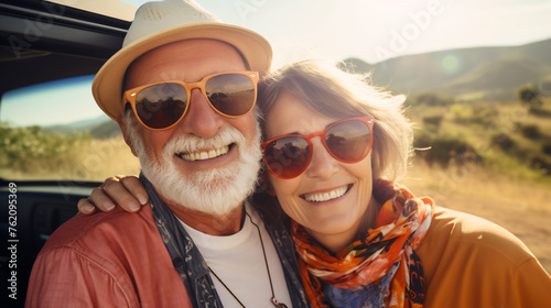 Happy Senior Couple with Sunglasses Sharing a Joyful Moment on a Sunny Hillside, Embracing Life and Love in a Picturesque Outdoor Setting © AspctStyle