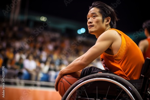 A young man from Japan, determined and focused, in his wheelchair, representing his country in wheelchair basketball at the Paralympic Games. © Hanna Haradzetska