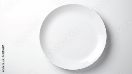 A white empty round plate on a white background, an image with copy space