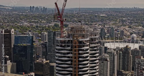 Vancouver BC Canada Aerial v111 drone fly around The Butterfly residential complex under construction with panoramic views of cityscape, harbour, mountain - Shot with Mavic 3 Pro Cine - July 2023 photo