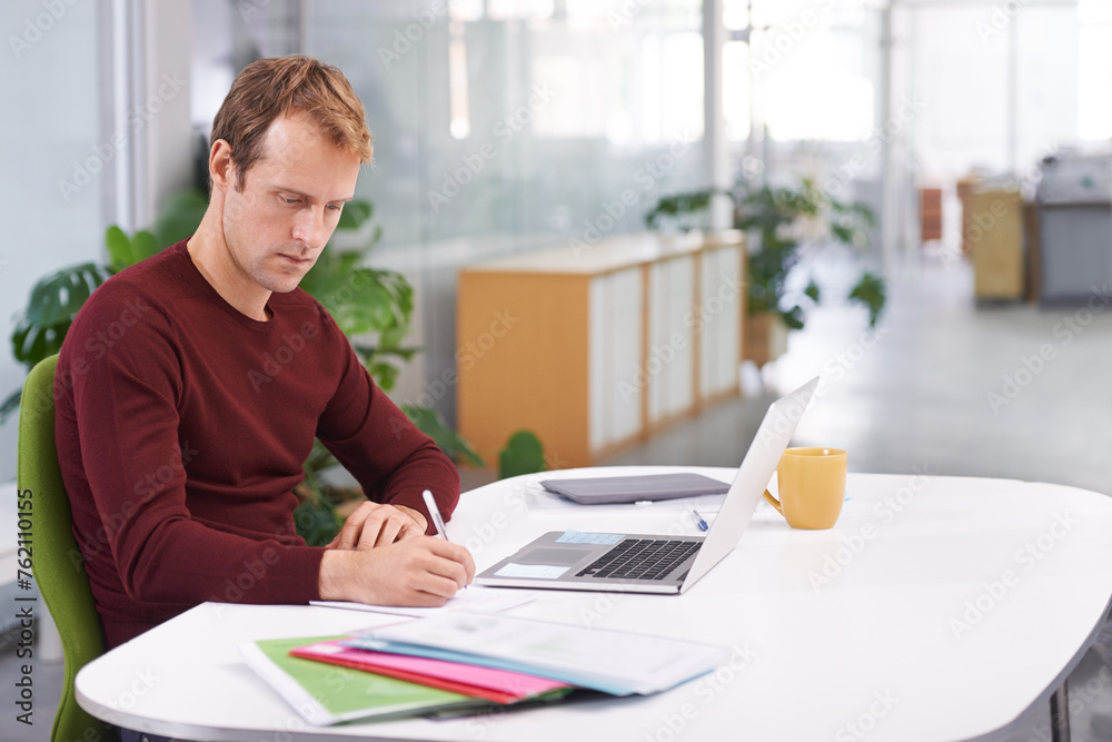 Creative, office and business with man, writing or documents for a project or computer. Person, employee or copywriting with entrepreneur or planning with ideas or laptop with paperwork or schedule Creative, office and business with man, writing or documents for a project or computer. Person, employee or copywriting with entrepreneur or planning with ideas or laptop with paperwork or schedule