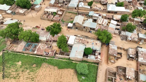 Aerial - Spinning top view over restive rural town in Northern Nigeria photo