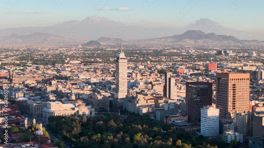 Drone shot of bellas artes palace and volcanoes in mexico city Drone shot of bellas artes palace and volcanoes in mexico city