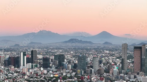 Drone shot of mexico city with volcanoes in sight photo