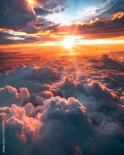 A breathtaking view above the clouds with sunlight piercing through