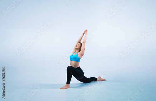 Full body length gaiety shot athletic and sporty woman doing healthy and meditative yoga exercise workout posture on isolated background. Healthy active and body care lifestyle