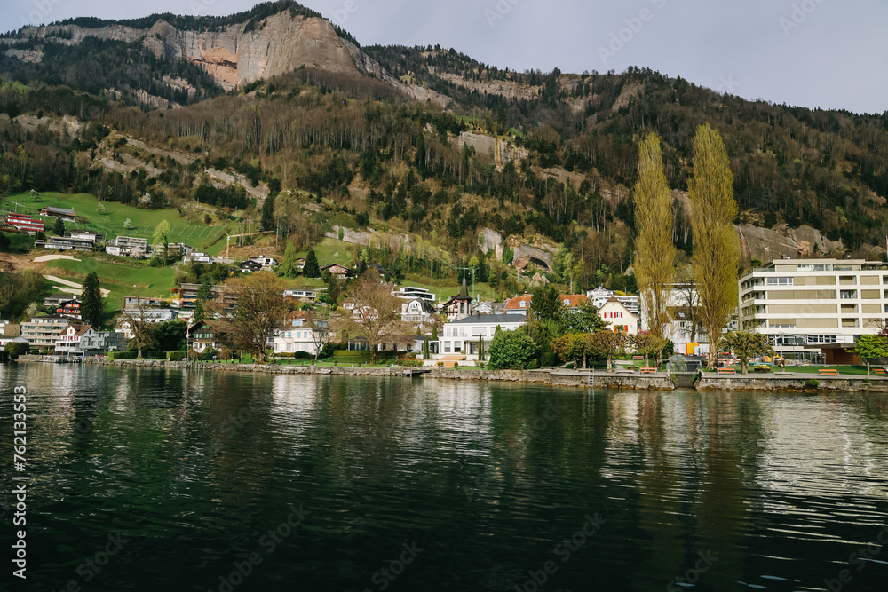 Fototapeta premium Waterview on Swiss village, house or castle near Lucerne, Switzerland.