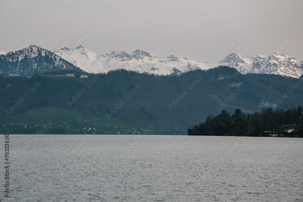 Scenic view of mountains with snowy peaks on lake lucerne.