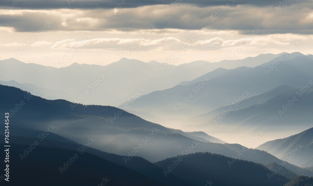Fototapeta premium Mountain layers veiled by clouds
