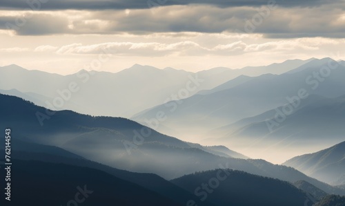 Mountain layers veiled by clouds 