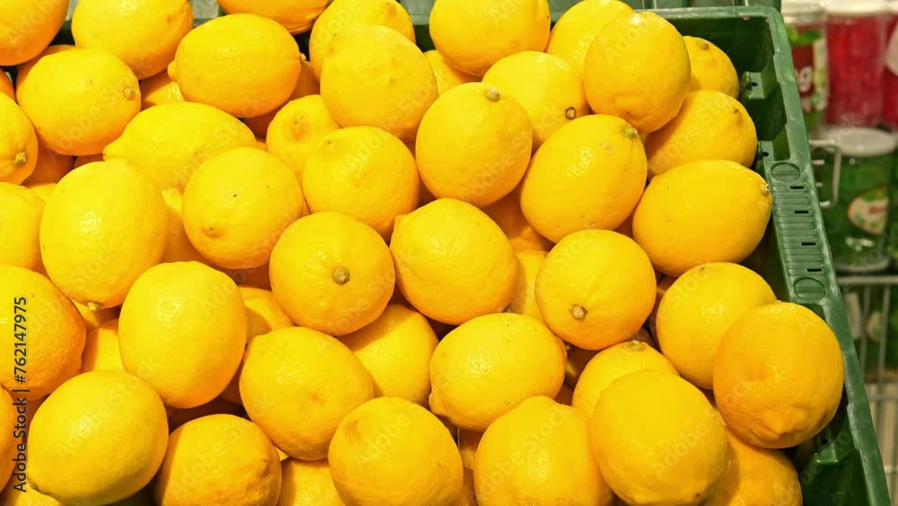 Lemons rest on shelf at the store, vibrant and fresh. Explore the citrusy goodness of lemons as they lie beautifully displayed. Indulge in the zest of lemons captured in this footage. Lemons rest on shelf at the store, vibrant and fresh. Explore the citrusy goodness of lemons as they lie beautifully displayed. Indulge in the zest of lemons captured in this footage.