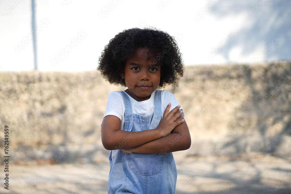 Portrait happy african american cute girl smiling face looking at camera at home, kid, child, young adorable, student, elementary school and education concept Portrait happy african american cute girl smiling face looking at camera at home, kid, child, young adorable, student, elementary school and education concept