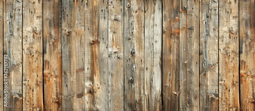 Vintage brown wooden wall texture with a pattern background. © Lasvu