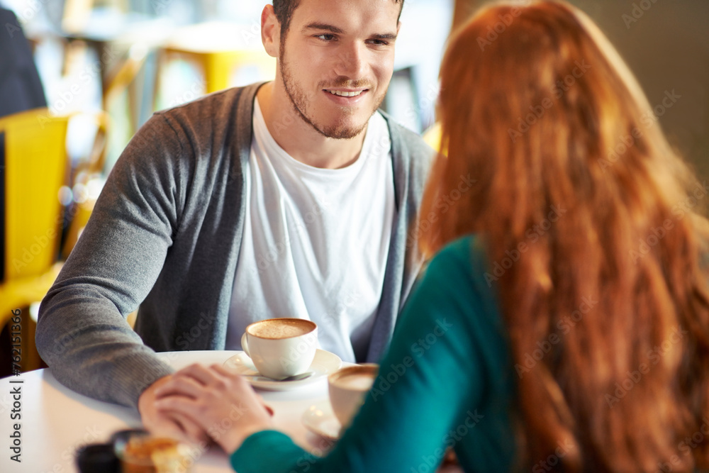 Couple, man and smile for touch in coffee shop, love and support with happiness for peace in marriage. Adult, male person and together with girl or partner holding hands in cafe, joy and relax Couple, man and smile for touch in coffee shop, love and support with happiness for peace in marriage. Adult, male person and together with girl or partner holding hands in cafe, joy and relax