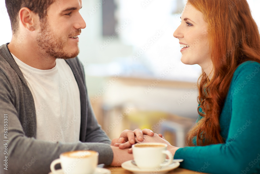 Couple, bonding and touch of hands in cafe, support and happiness for peace in relationship. Adult, woman and girl with man or partner with hand in coffee shop, smile and joy for marriage with guy Couple, bonding and touch of hands in cafe, support and happiness for peace in relationship. Adult, woman and girl with man or partner with hand in coffee shop, smile and joy for marriage with guy