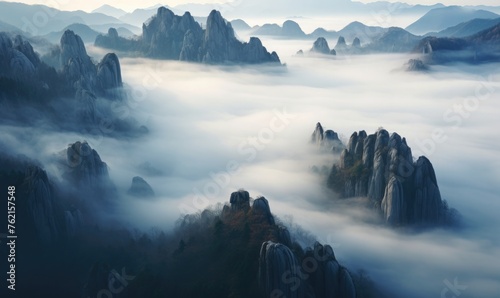 the surreal beauty of mountains shrouded in thick fog 