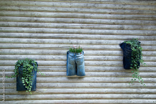 Upcycling and recycling concept - old jeans are now used as planting pots