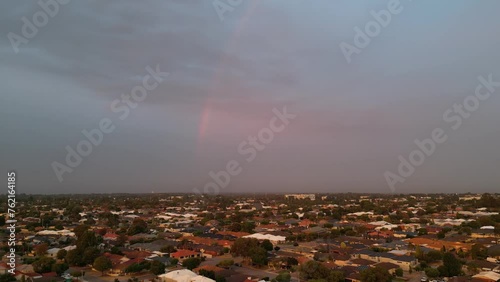 Aerial view of northern Perth suburbs with a rainbow at sunset, Western Australia photo