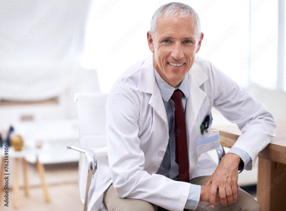 Portrait, senior doctor and happy man in hospital for healthcare, wellness and working in Australia for career. Smile, medical professional and surgeon, expert and physician in clinic for service