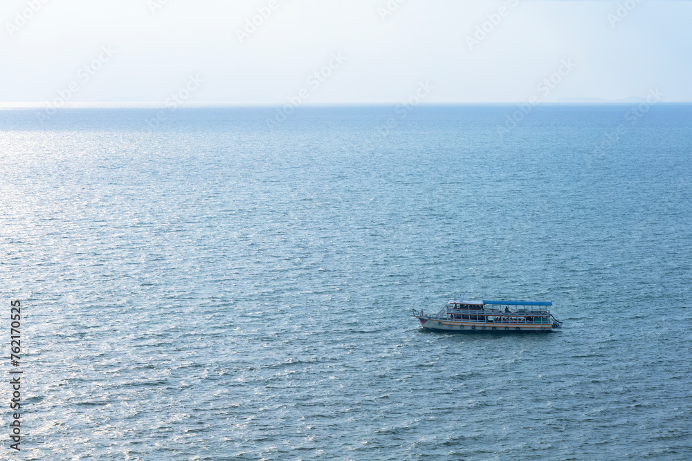 A cruise ship with people tourists in the sea. Boat trip ship tour tourists people.