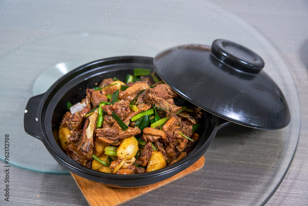 A pot of delicious braised duck with water chestnuts, home cooking