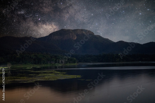Starry Night over Tranquil Mountain Lake © apichat