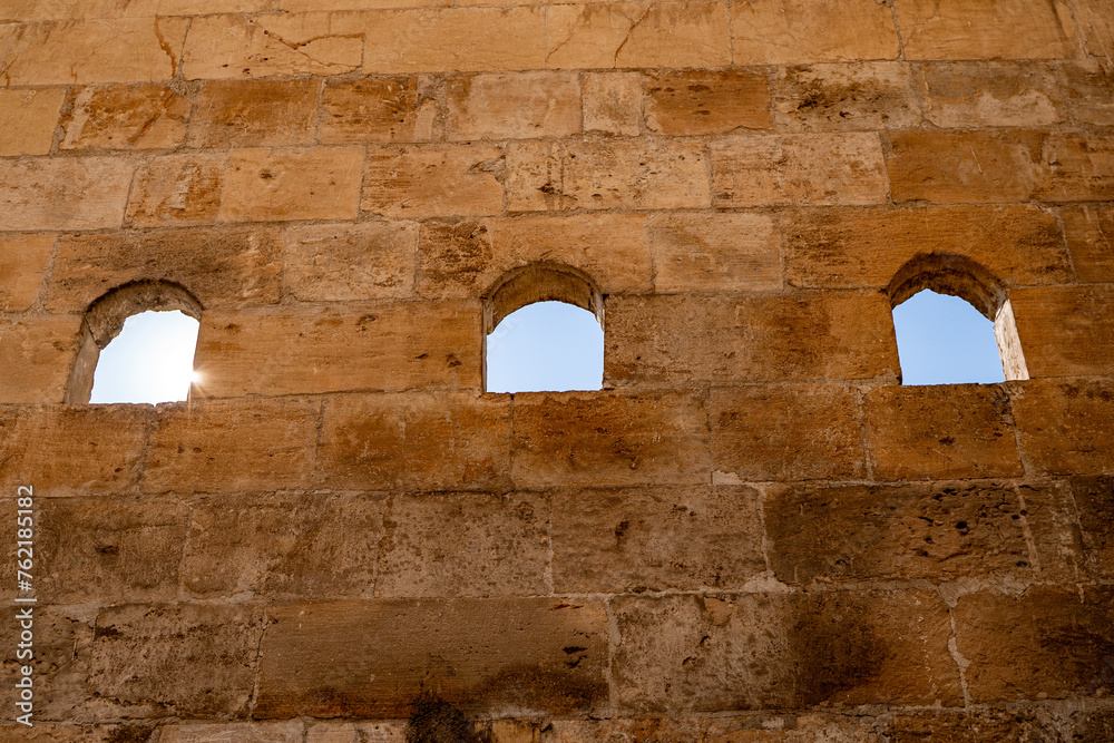 Windows in the stone wall in Sanliurfa city center.