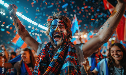 Vibrant Portrait of a Joyful male Scotland Supporter with a Scottish Flag Painted on His Face, Celebrating at UEFA EURO 2024 photo
