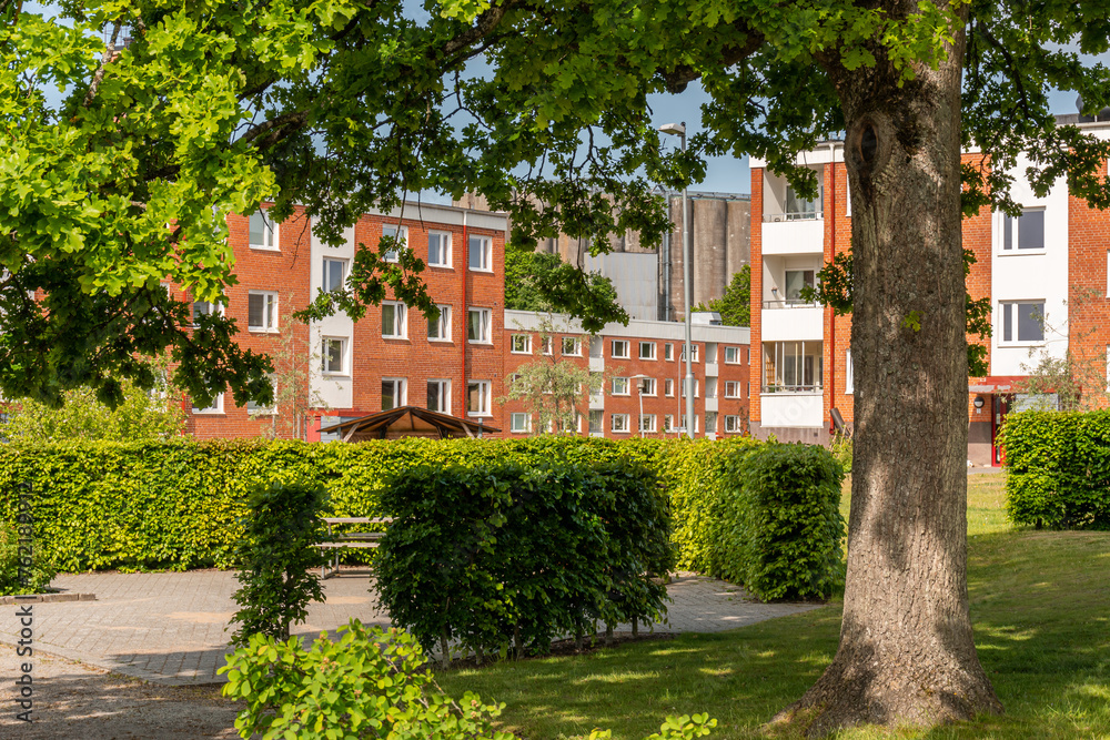 Typical low-rise residential buildings in Sweden. Comfortable recreational area during a hot summer day. 