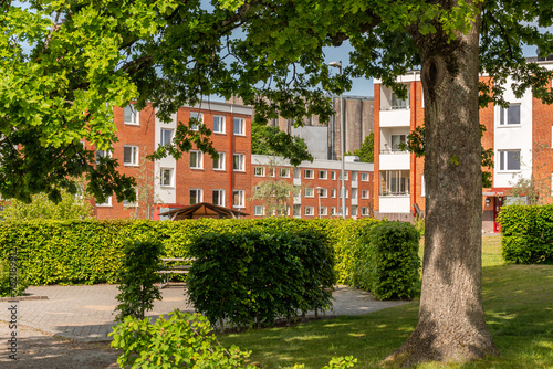 Typical low-rise residential buildings in Sweden. Comfortable recreational area during a hot summer day.  © Bohdan