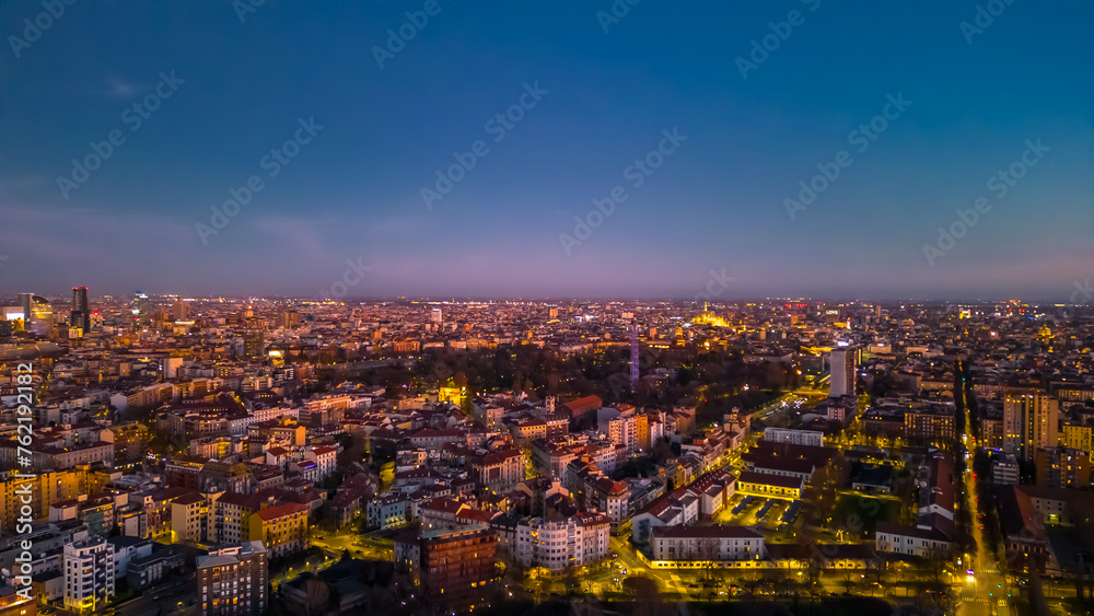 Fototapeta premium Beautiful panoramic aerial view of Milan city at sunset. Metropolis concept.