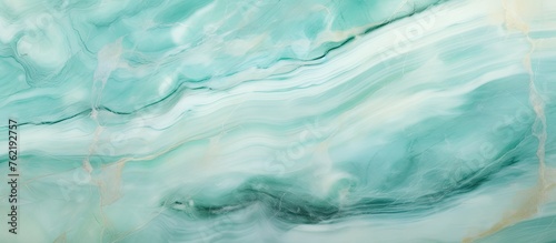 A mesmerizing closeup of a swirling blue and white marble texture, resembling water, liquid, fluid, and wind waves. The electric blue pattern is reminiscent of the sky and clouds