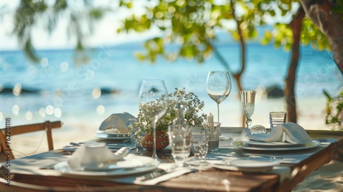 Table setting for an event party or wedding reception at the beach photo