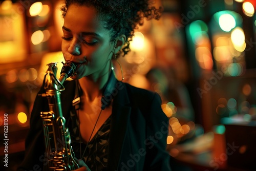 Biracial woman playing the saxophone in a jazz bar with blurry background and lights.