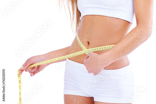 Woman, studio and waistline for measuring, health and wellness with diet and weight loss. Person, abdomen and commitment for training, goals and fitness with exercise or workout for proud body care