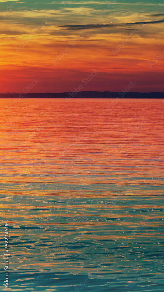 Seascape in the evening. Sunset over the sea. Dramatic sky. Natural landscape. Vertical banner Seascape in the evening. Sunset over the sea. Dramatic sky. Natural landscape. Vertical banner