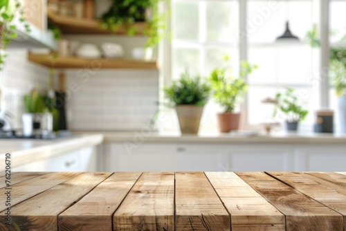 Empty wooden table and blurred background of modern kitchen, product display montage