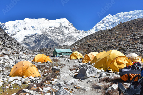 Climbers resting in a tent after hard day, base camp near the Island Peak in the Himalayas, beautiful sunny day blue sky in Himalaya, Nepal