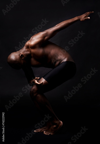 Black man, dancer and fitness with muscular body for energy, style or art on a dark studio background. African male person, performer or bodybuilder in pose for muscle or strength on mockup space