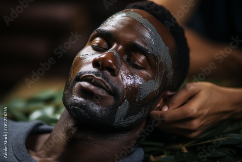 Man Receiving Facial Mask Treatment