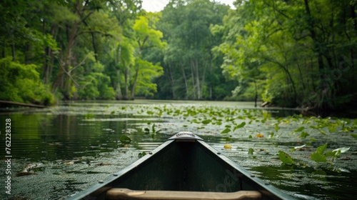 A serene lake surrounded by lush greenery, perfect for kayaking and canoeing.
