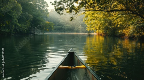 A serene lake surrounded by lush greenery, perfect for kayaking and canoeing. © Shahjahan