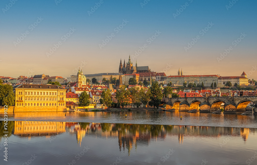 The scenic view of Prague Castle, St. Vitus Cathedral and Vltava river, Prague, Czech Republic at sunrise.