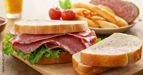 Mouthwatering assortment of deli meats, including ham, roast beef, and salami, stacked between slices of bread in this delectable sandwich clipart. photo