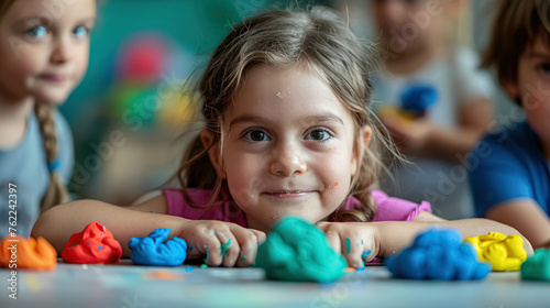 Kid Girl Ready To Create Things With Modeling Clay Of Different Colors. Tactile Experience. Fun And Creativity Of Children