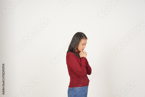 Young Asian woman in Red t-shirt closed eye fold hand and praying isolated on white background