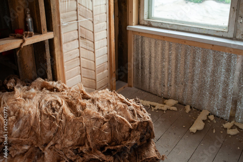 Slag wool and insulation inside a house under construction photo