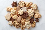 Assortment of Christmas shaped cookies in a pile on white table. Top view. Horizontal composition.