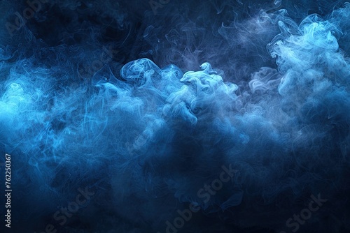 A dense trail of blue smoke drifting across a black back photo
